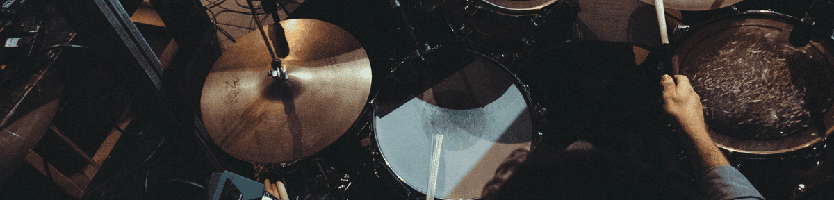 a person playing a drum set