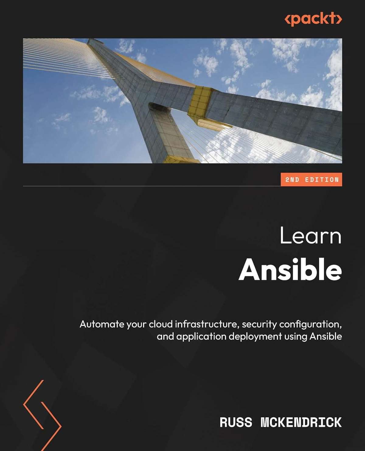 Cover image of the book 'Learn Ansible' by Russ McKendrick, 2nd edition, featuring a photograph of a modern bridge against a blue sky. The book focuses on automating cloud infrastructure, security configuration, and application deployment using Ansible, published by Packt.